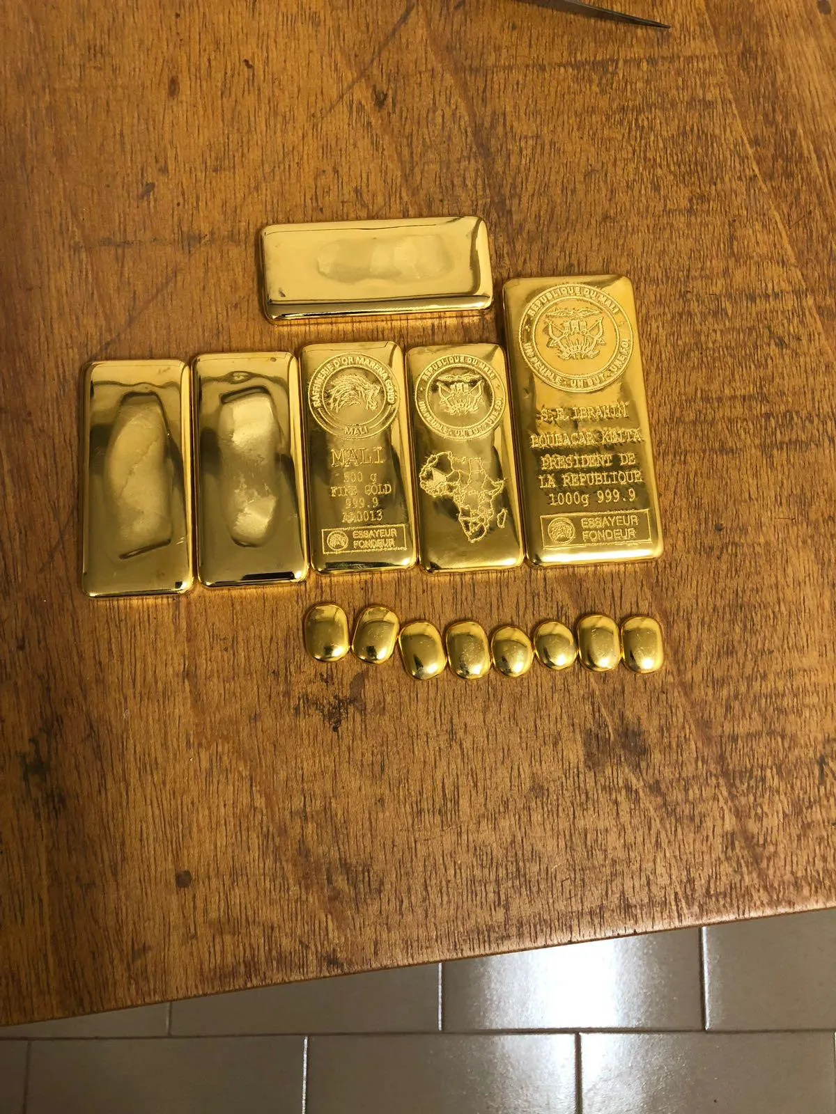 Engraved gold bars from the Republic of Mali, including a presidential commemorative bar.